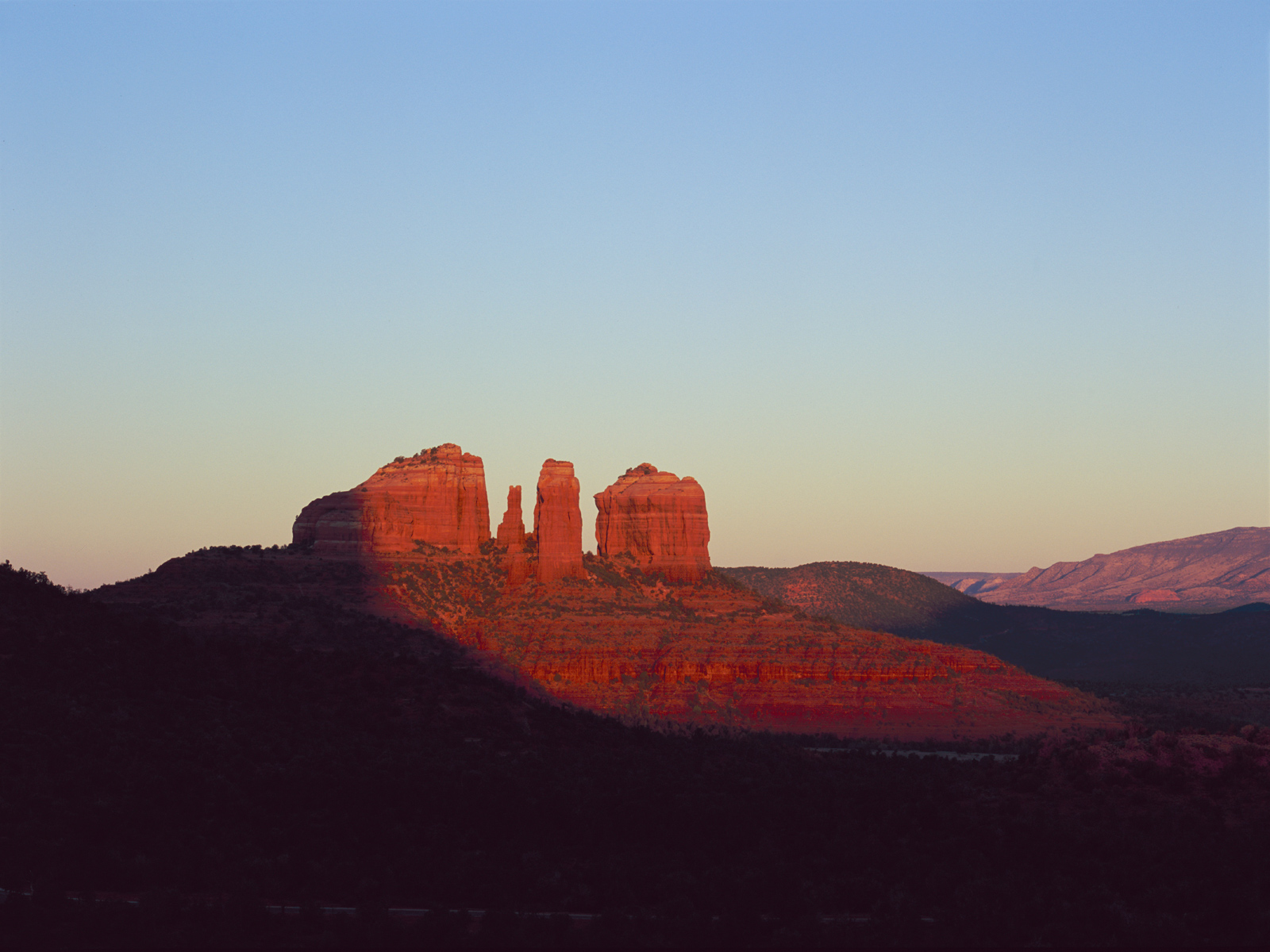 Sunrise on Cathedral Rock as seen from the hill between Chicken Point and Bell Rock