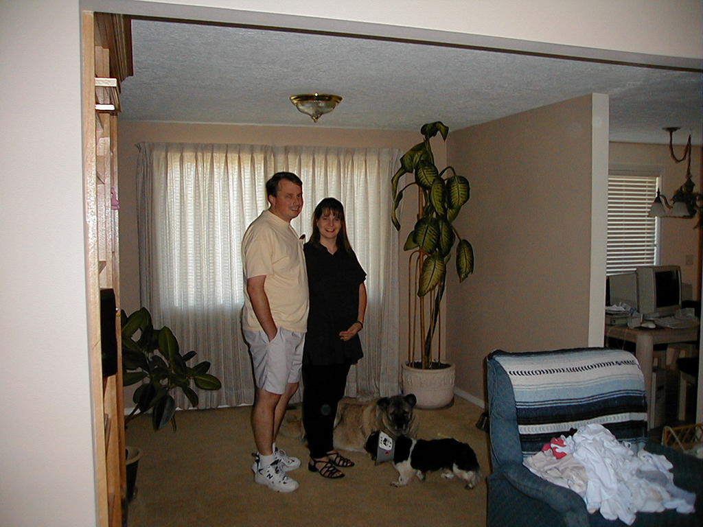 Paul, Rochelle pregnant with Miles, Taaka, and Gizmo in their home in Oregon