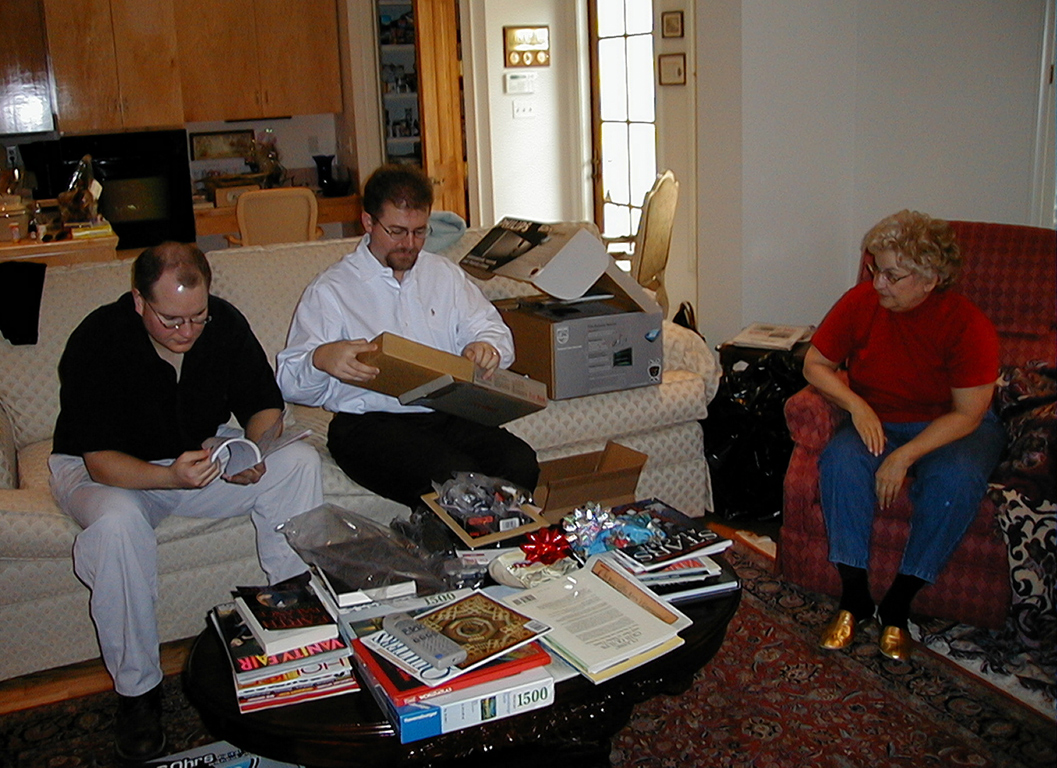 Marc, Steve, and Mom opening gifts on Christmas Day