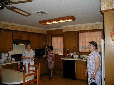 Aunt Lou, Gai, and Aunt Dory standing in Aunt Lou's kitchen