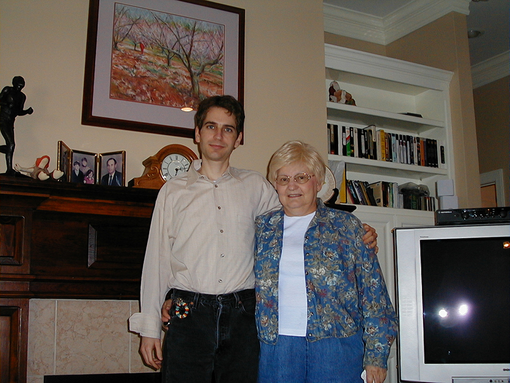 Dan and Mom in front of Mom's fireplace