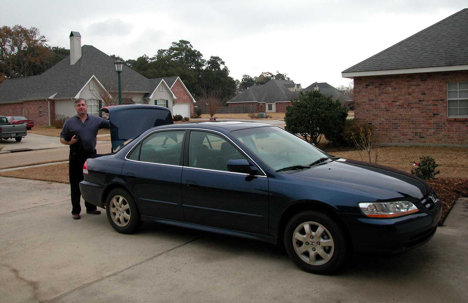 John Dempsey with his new Honda ACCORD® in Mom's driveway