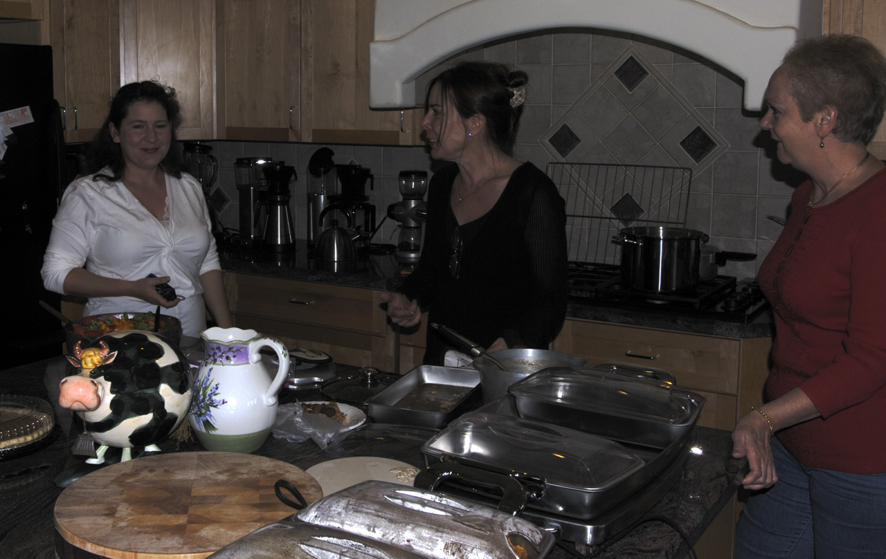 Jackie, Keri, and Cairn preparing Thanksgiving Dinner in Marc's kitchen