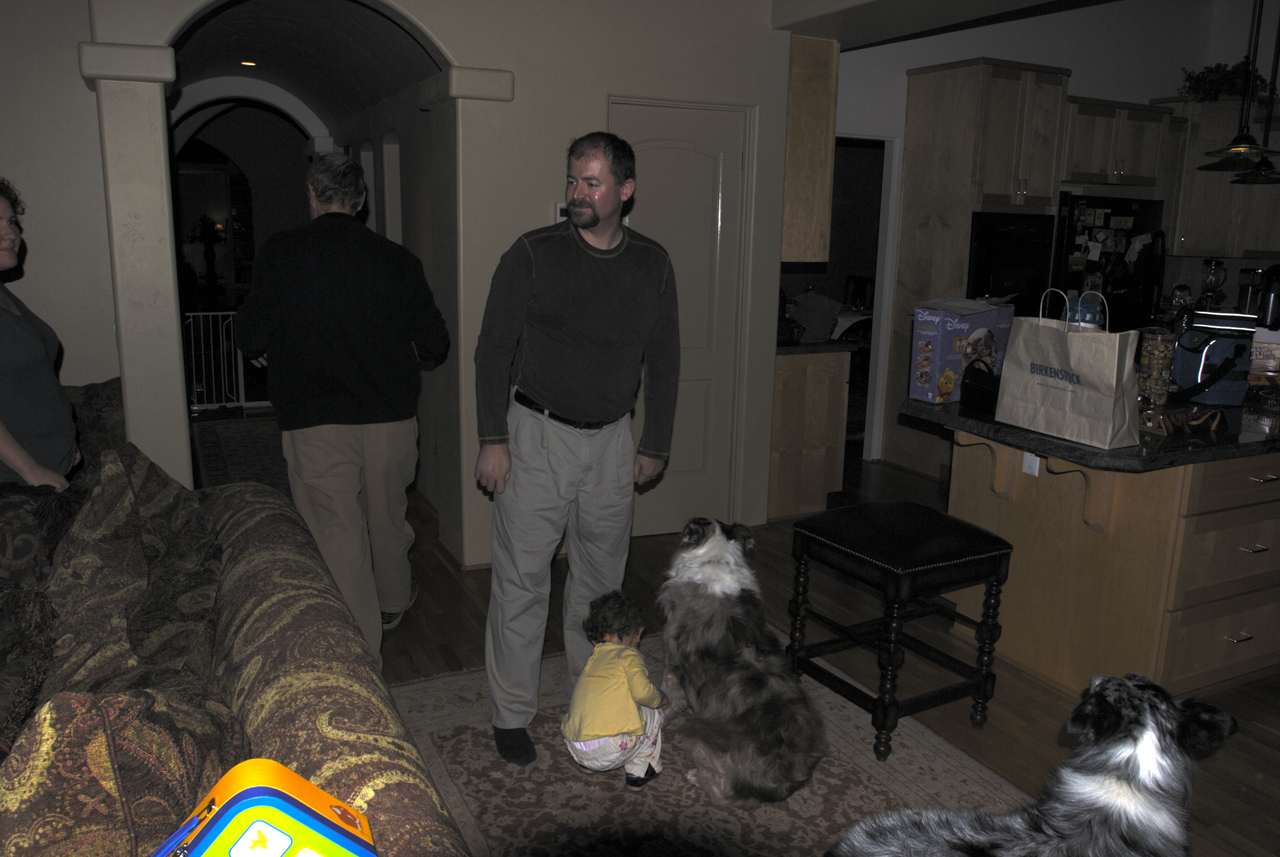 Marc, Steve, Sophia, and Keri's dog Jackie Chan in Marc's living room
