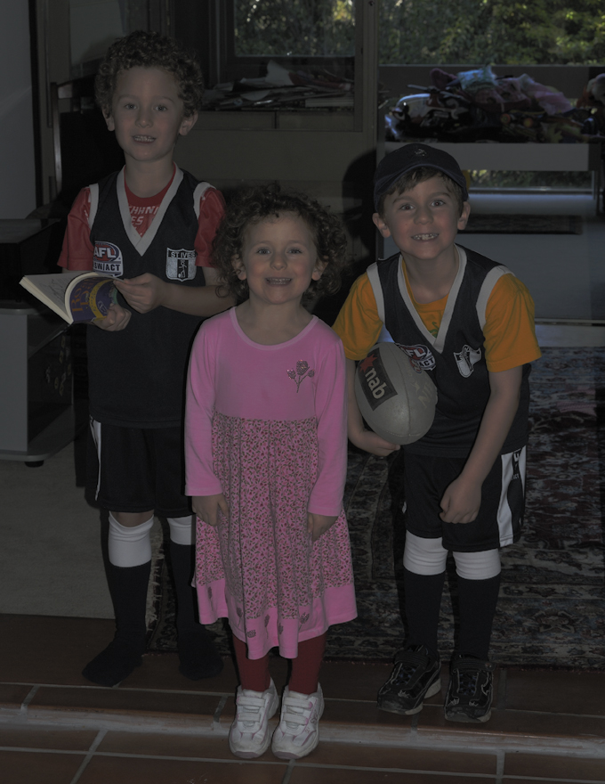 John, Sophia, and James ready to play Australian Rules Football