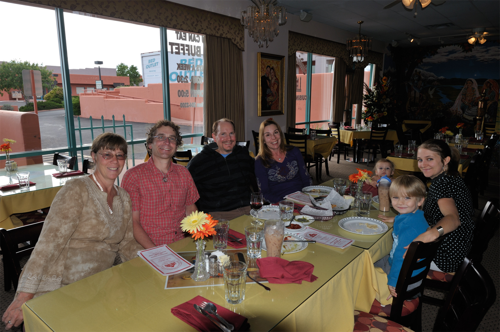 Adele and me, Marc and Keri, Dia, Niko, and Sarah considering the dinner menu at INDIA PALACE®