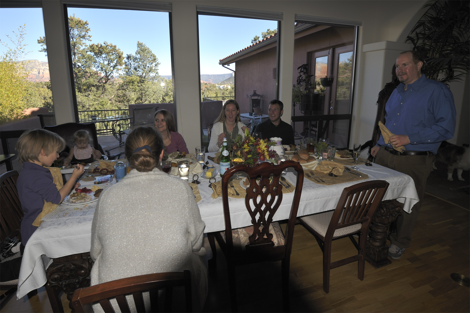 Nikko, Dia, Adele, Sarah, Luna and Joey, and Marc preparing to eat Thanksgiving Dinner