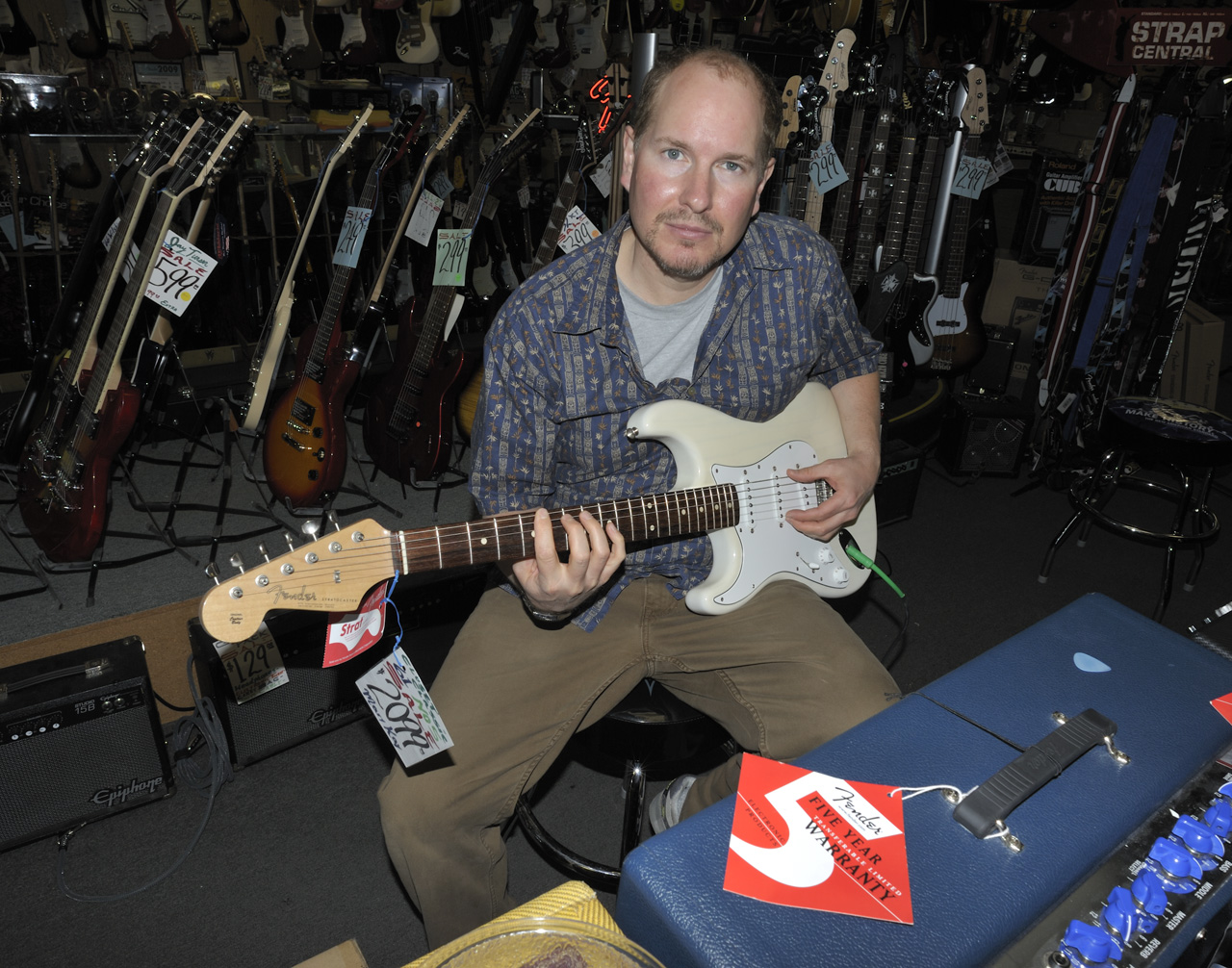 Marc jamming on a Fender STRATOCASTER® at SOUTHPAW'S® guitar shop in Houston