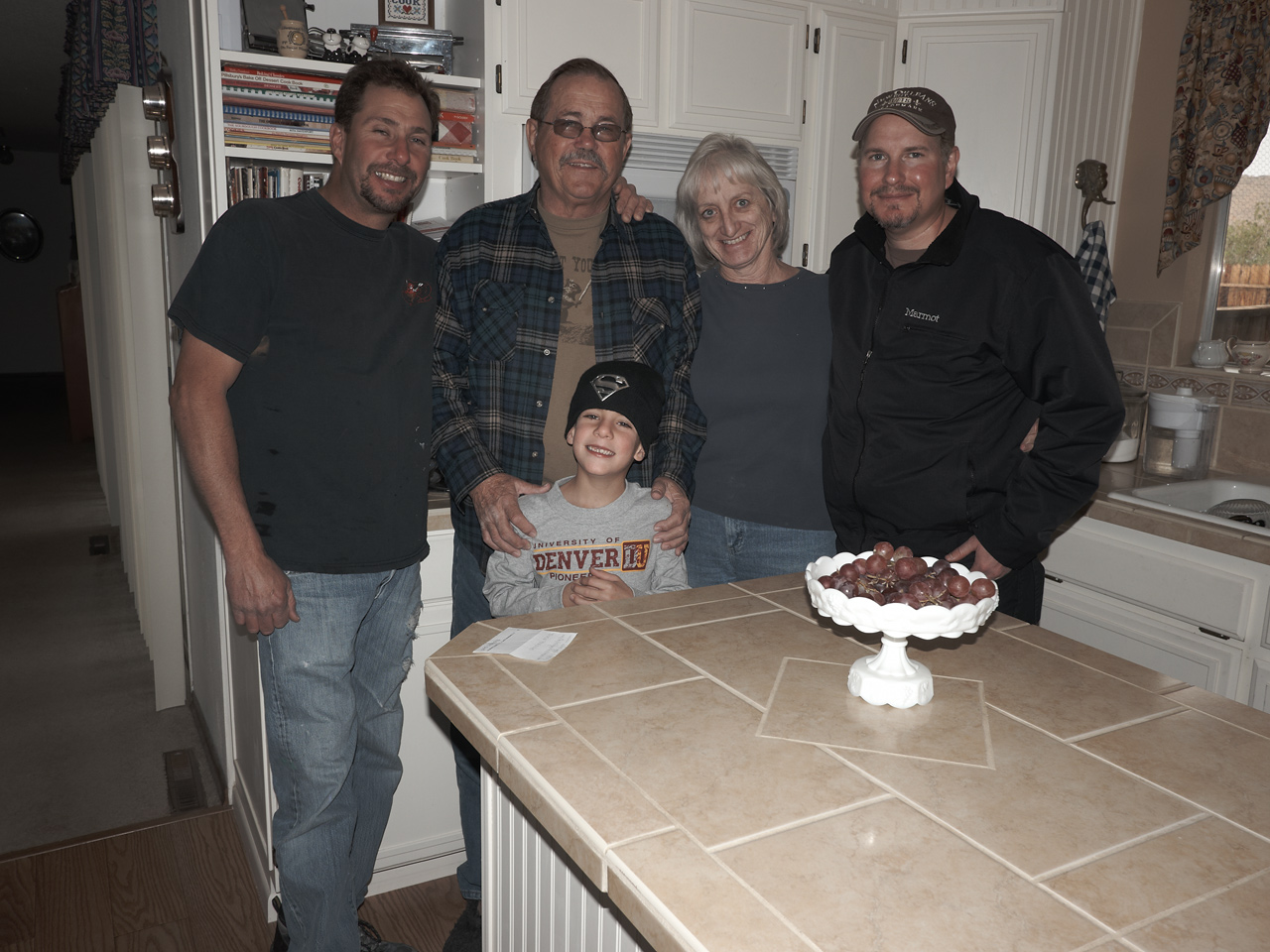 Marc, Tom's son Hunter, Uncle Bill, Lynne, and Dan in Uncle Bill and Lynne's kitchen
