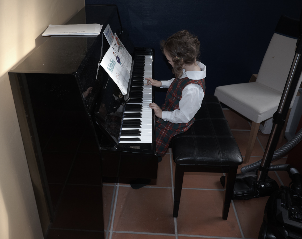 Sophia practicing piano before school
