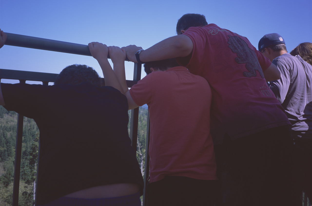 John, James, and Steve watching their balsa wood airplanes float down to the ground from the top of the Astoria Column