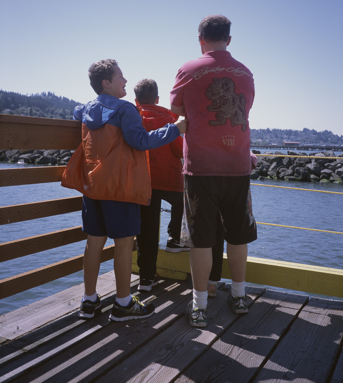 John, James, and Steve watching the seals frollicking in the Columbia River on PIER 39 in Astoria