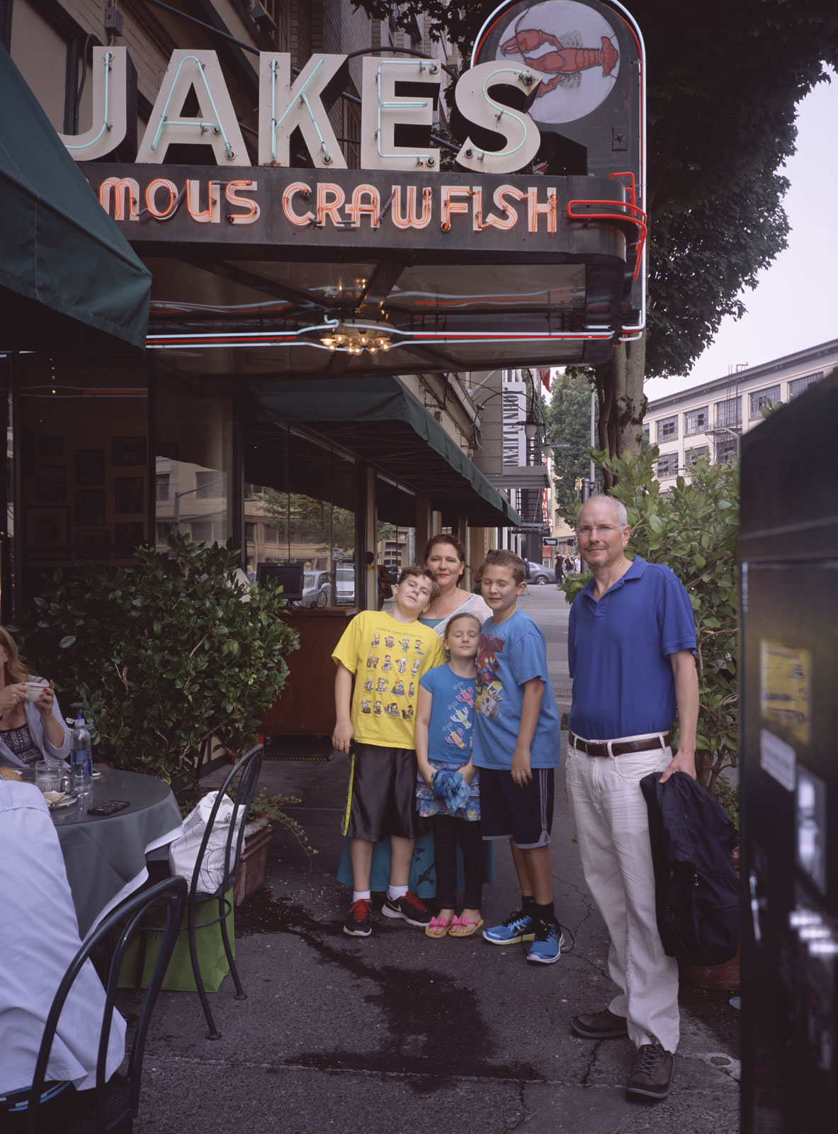James, Jackie, Sophia, John, Sophia, and Marc standing outside the entrance to JAKE'S FAMOUS CRAWFISH restaurant