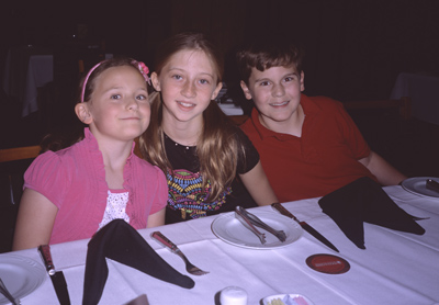 Sophia, Erin, and James waiting to get some food at FOGO DE CHAO
