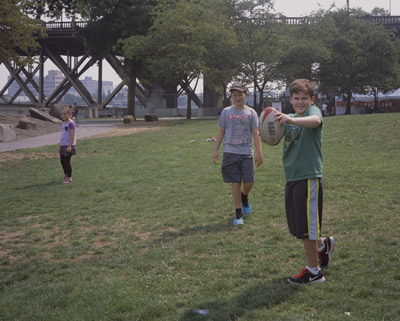 Sophia, John, and James playing football in the Japanese American Historical Plaza