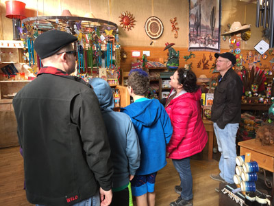 Steve, James, John, Jackie, and Marc checking out the merchandise in LAUGHING MOUNTAIN