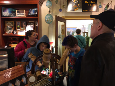 Jackie, James, John, and Marc checking out kaleidoscopes in the shop NELLY BLY