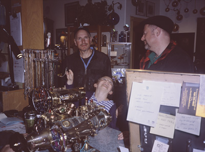 Marc, Sophia, and Steve checking out SteamPunk kaleidoscopes in NELLY BLY