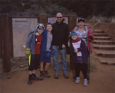 James, John, Steve, Sophia, and Jackie standing before the Doe Mesa trailhead in west Sedona