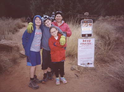John, James, Sophia, and Jackie standing before the Fay Canyon trailhead in west Sedona