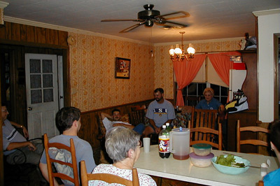 Felix, Louis, Eric Fontenot, Aunt Lou, Eric, and Mom sitting in Aunt Lou's kitchen